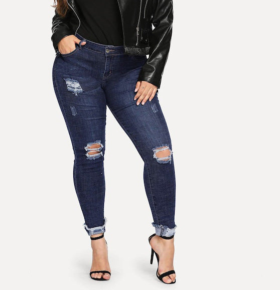 Shredded plus size women's jeans