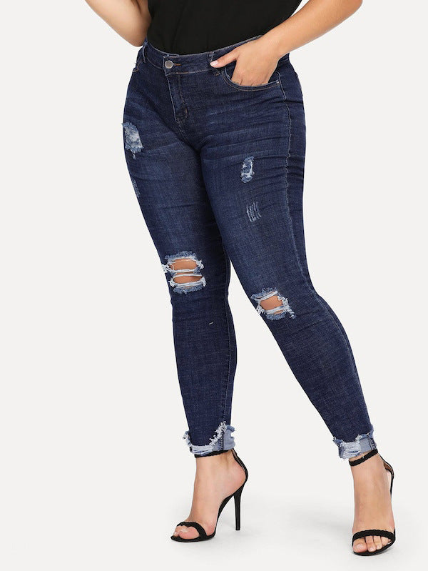 Shredded plus size women's jeans